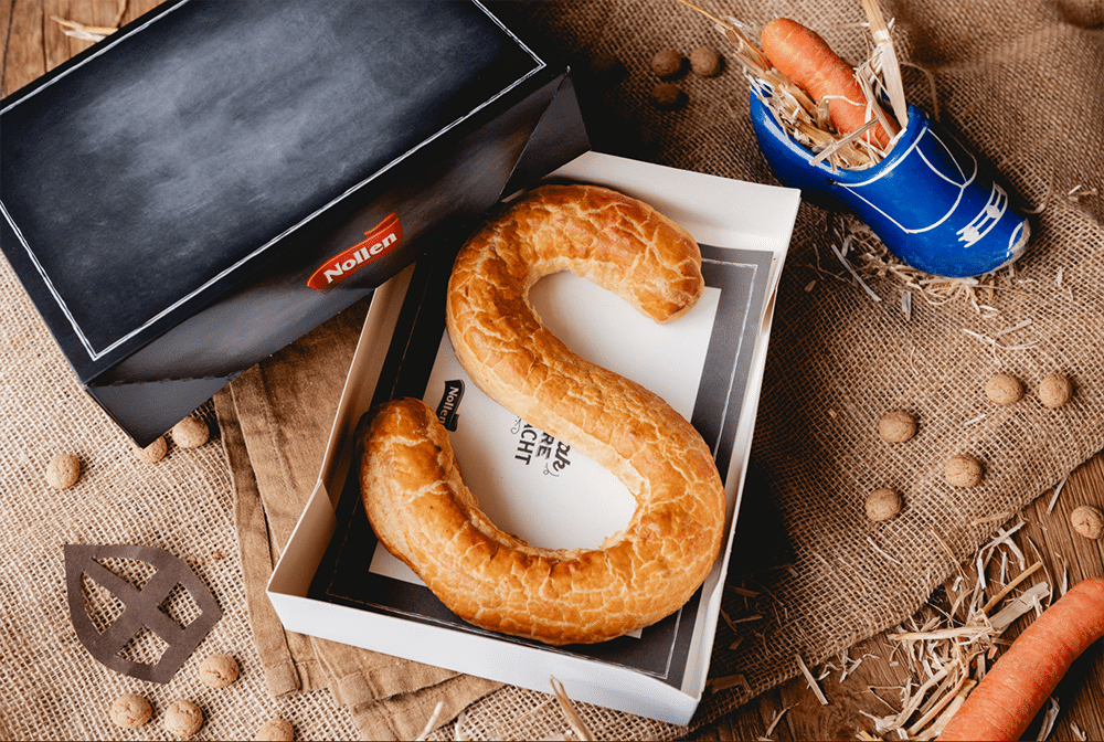 Een banketletter van bakkerij Nollen hoort bij een heerlijk avondje
